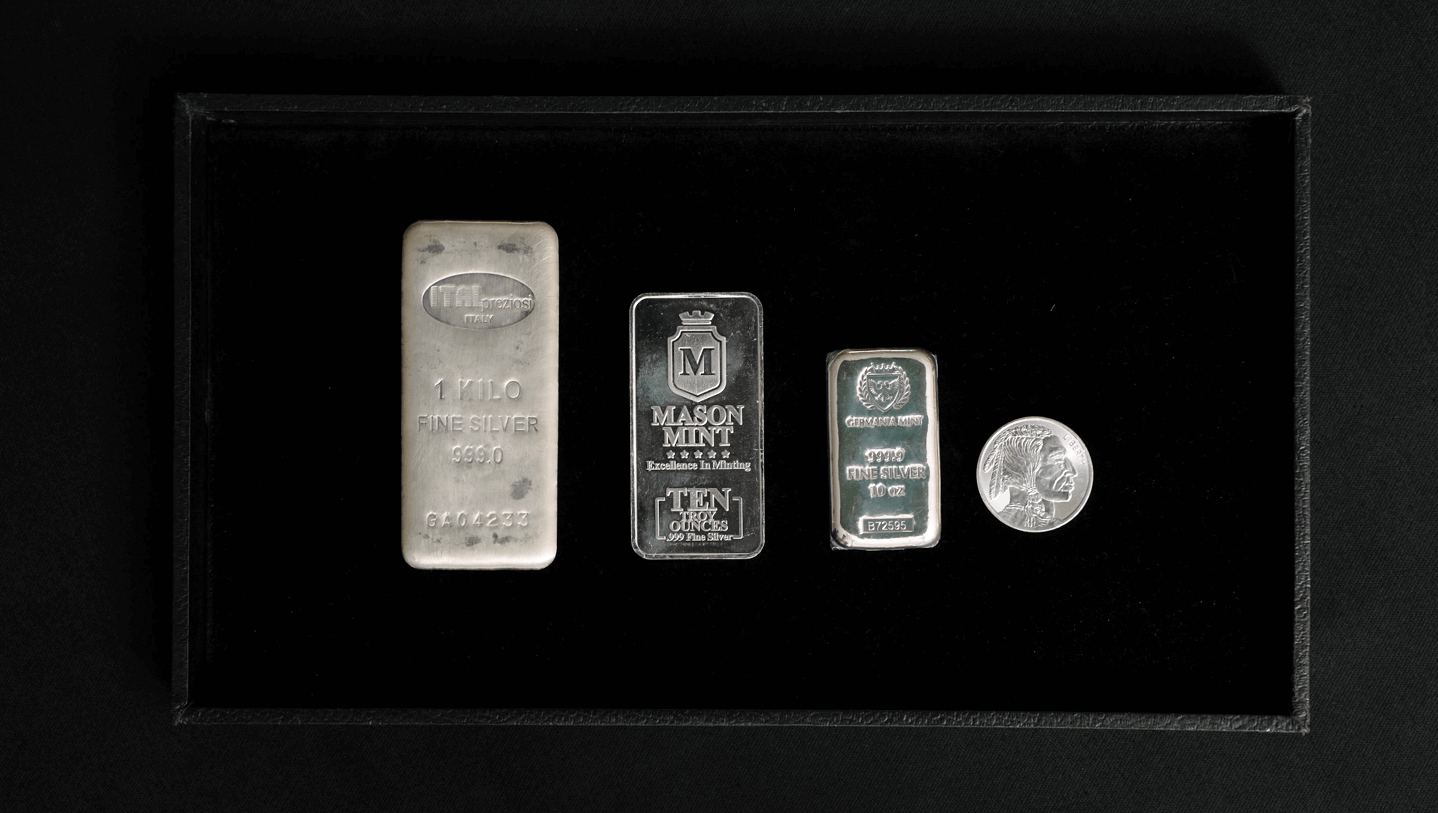 Silver bars and silver coins size comparison